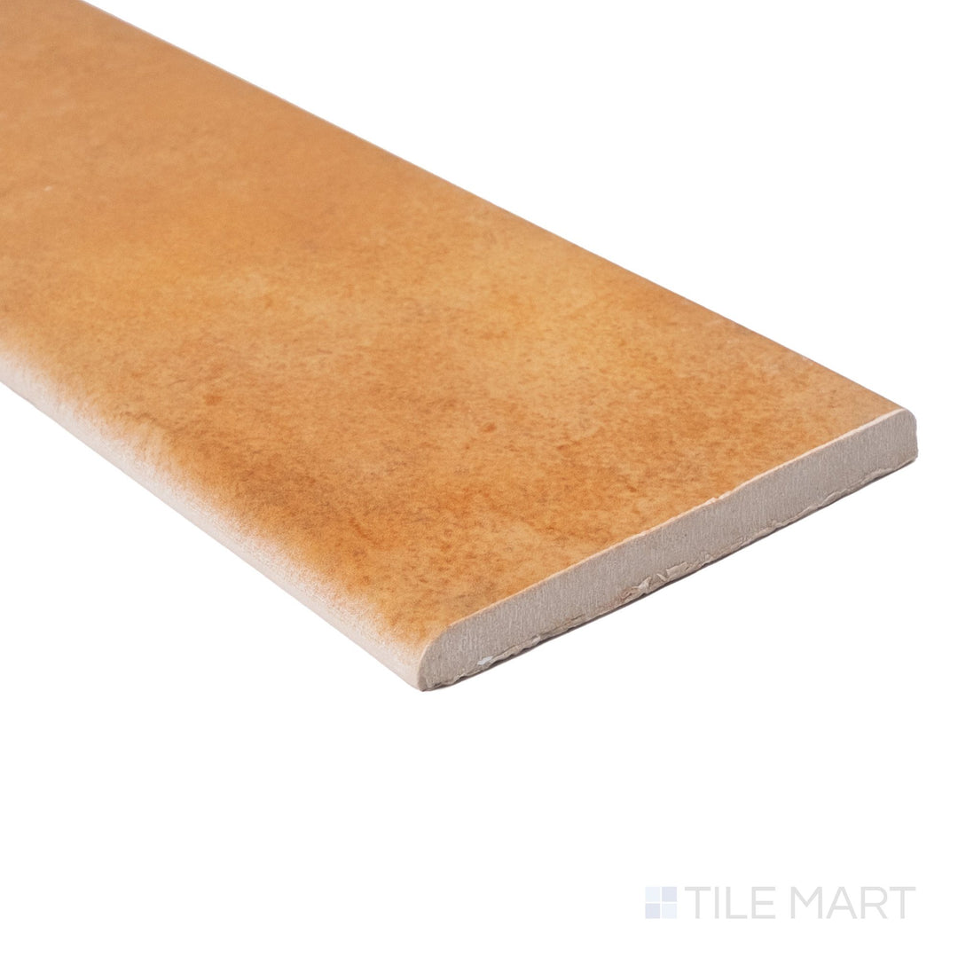 Cotto Nature Cerdena 4x14 gloss porcelain bullnose shown at corner angle with polished surface and rounded edge