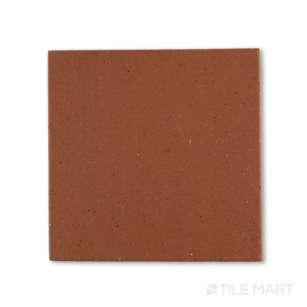 Top-down view of Metropolitan Mayflower Red 6x6 honed quarry tile, featuring a deep red tone with a smooth matte finish typical of industrial-grade quarry tile.