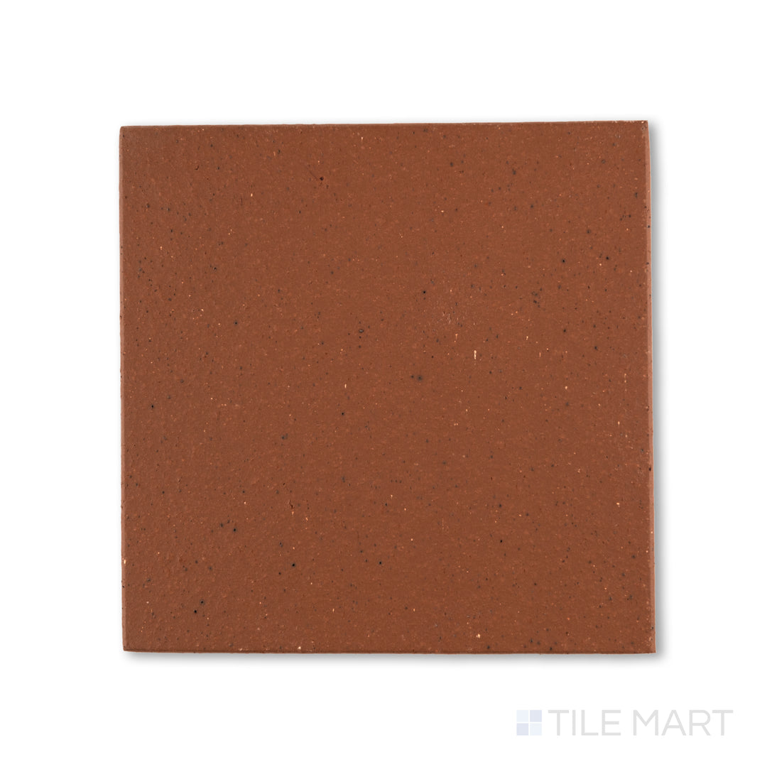 Top-down view of Metropolitan Mayflower Red 6x6 honed quarry tile, featuring a deep red tone with a smooth matte finish typical of industrial-grade quarry tile.