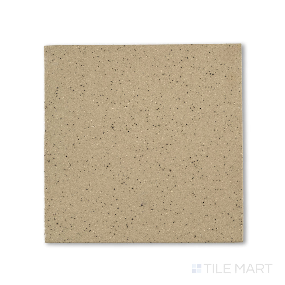 Flat-lay photo of Metropolitan Buckskin 6x6 honed quarry tile, presenting a warm tan coloration with a fine honed surface ideal for high-traffic flooring.