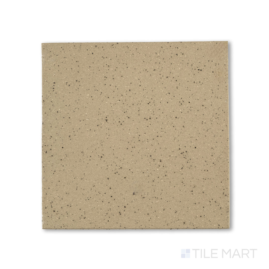 Flat-lay photo of Metropolitan Buckskin 6x6 honed quarry tile, presenting a warm tan coloration with a fine honed surface ideal for high-traffic flooring.