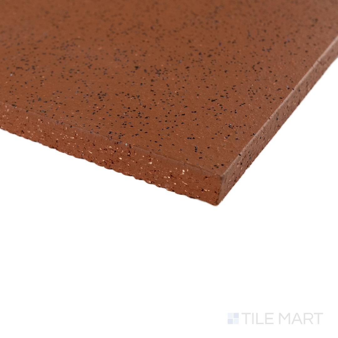 Corner close-up of Metropolitan Mayflower Red 6x6 XA abrasive honed quarry tile showing slip-resistant surface detail.