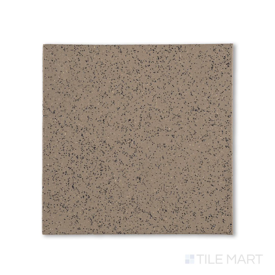 Top-down shot of Metropolitan Puritan Gray 6x6 XA abrasive honed quarry tile, blending a gritty finish with a mid-tone gray color for commercial safety.