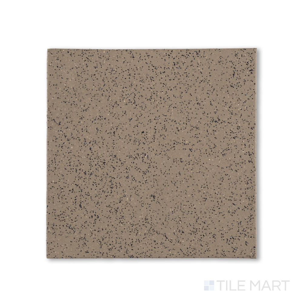 Top-down shot of Metropolitan Puritan Gray 6x6 XA abrasive honed quarry tile, blending a gritty finish with a mid-tone gray color for commercial safety.