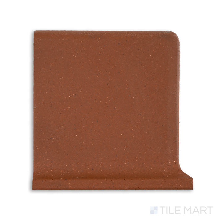 Top-down view of Metropolitan Mayflower Red 6x6 honed quarry cove base left corner tile, showcasing a curved inside edge in deep red for smooth corner transitions.