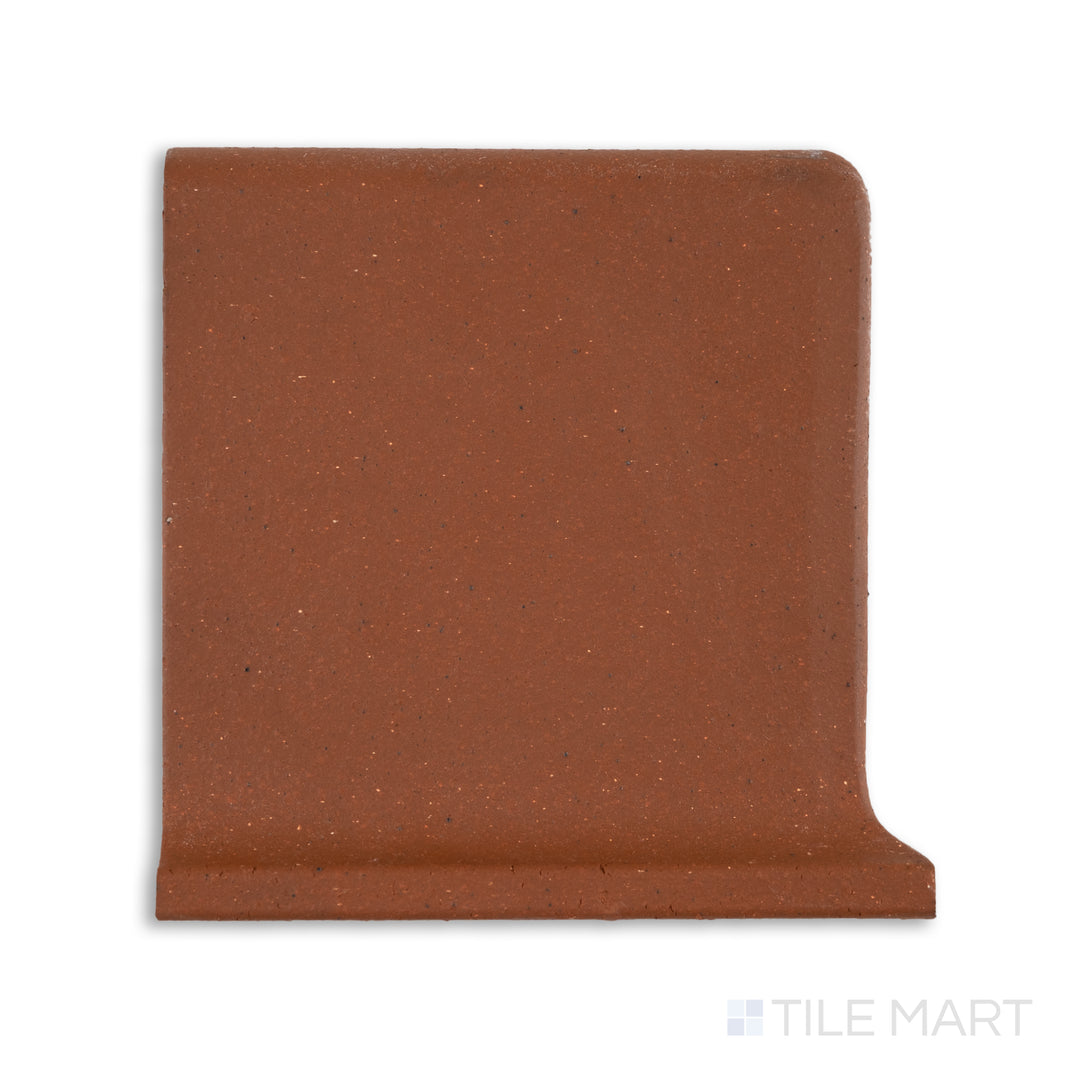 Top-down view of Metropolitan Mayflower Red 6x6 honed quarry cove base left corner tile, showcasing a curved inside edge in deep red for smooth corner transitions.