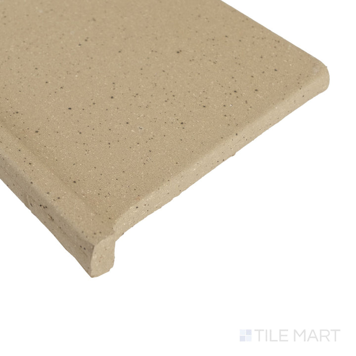 Corner detail of Metropolitan Buckskin 6x6 honed quarry cove base left corner featuring earthy tone and refined edge finish.