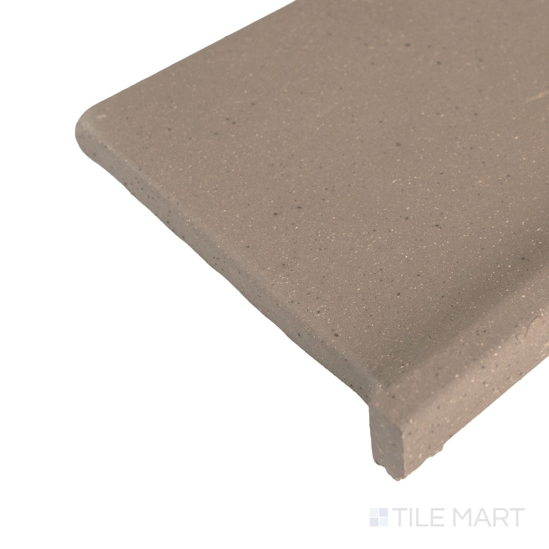 Corner detail of Metropolitan Puritan Gray 6x6 honed quarry cove base right corner highlighting neutral tone and clean edge.