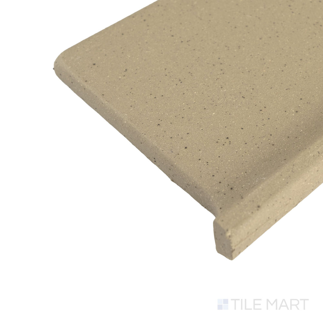 Corner view of Metropolitan Buckskin 6x6 honed quarry cove base right corner capturing warm tone and soft honed texture.