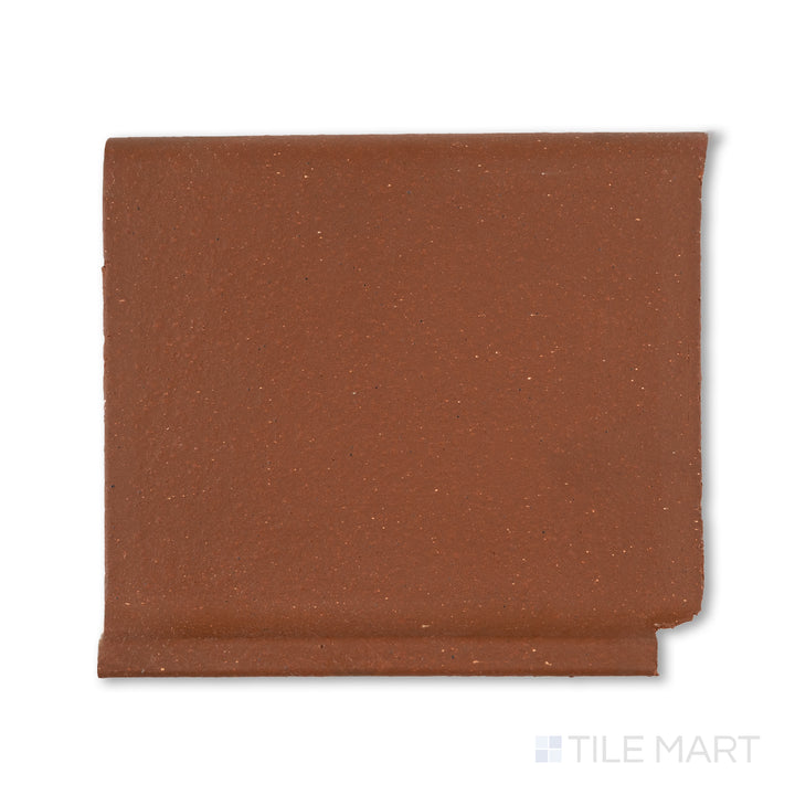 Top-down view of Metropolitan Mayflower Red 6x6 honed quarry cove base inside corner, designed for tight interior junctions with a curved red porcelain surface.