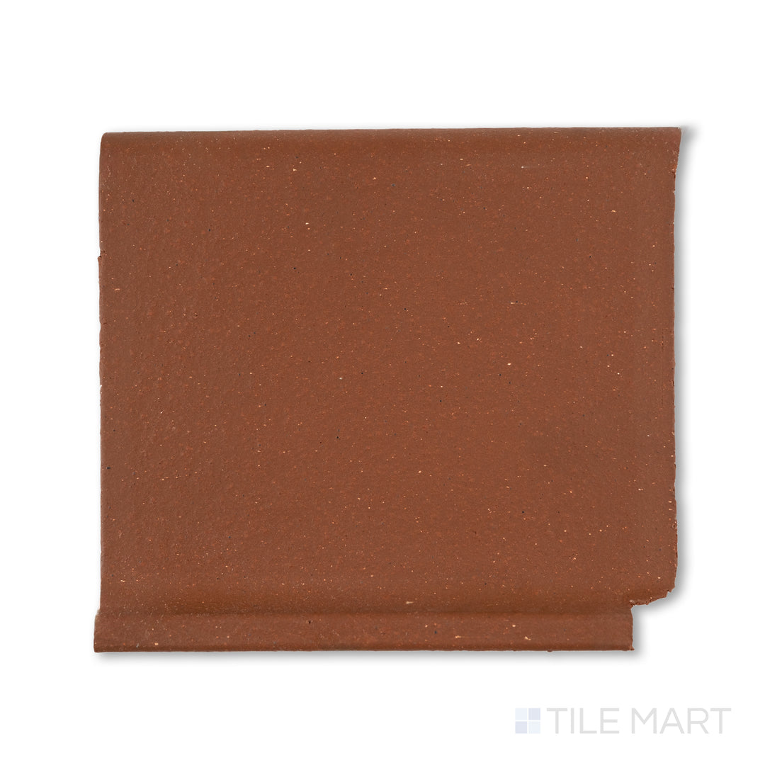 Top-down view of Metropolitan Mayflower Red 6x6 honed quarry cove base inside corner, designed for tight interior junctions with a curved red porcelain surface.