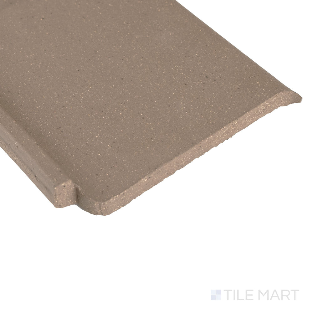 Corner detail of Metropolitan Puritan Gray 6x6 honed quarry cove base inside corner highlighting smooth contour and subtle texture.