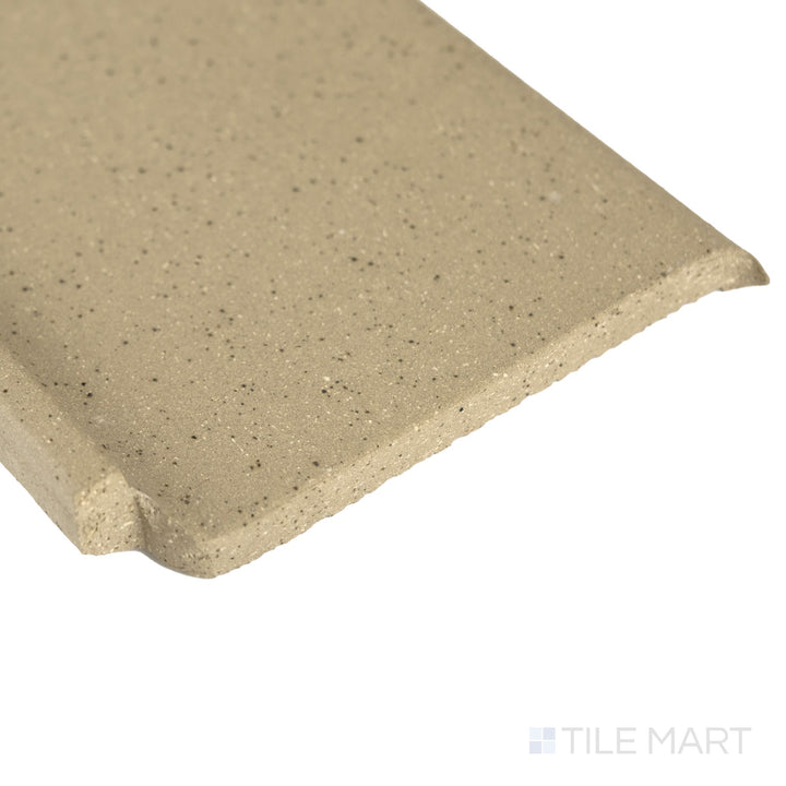 Corner close-up of Metropolitan Buckskin 6x6 honed quarry cove base inside corner featuring warm tone and softly honed finish.