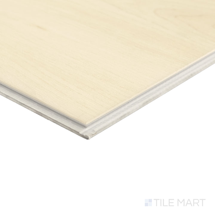 Corner detail of Shorewood Crema 9x60 luxury vinyl plank highlighting warm beige hue and realistic wood pattern.