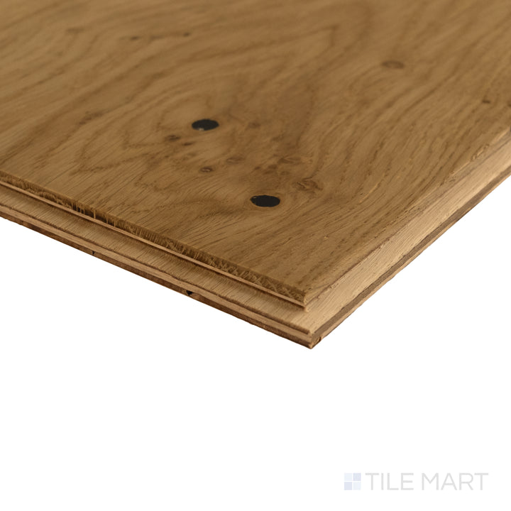 Corner detail of Newport Dune 7.5x75 engineered hardwood showing sandy beige tone and refined wood texture.