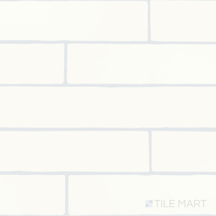 An overview of Farrier Cremello 2.5x15 satin glazed ceramic tiles, showcasing their smooth finish and warm, neutral tone.