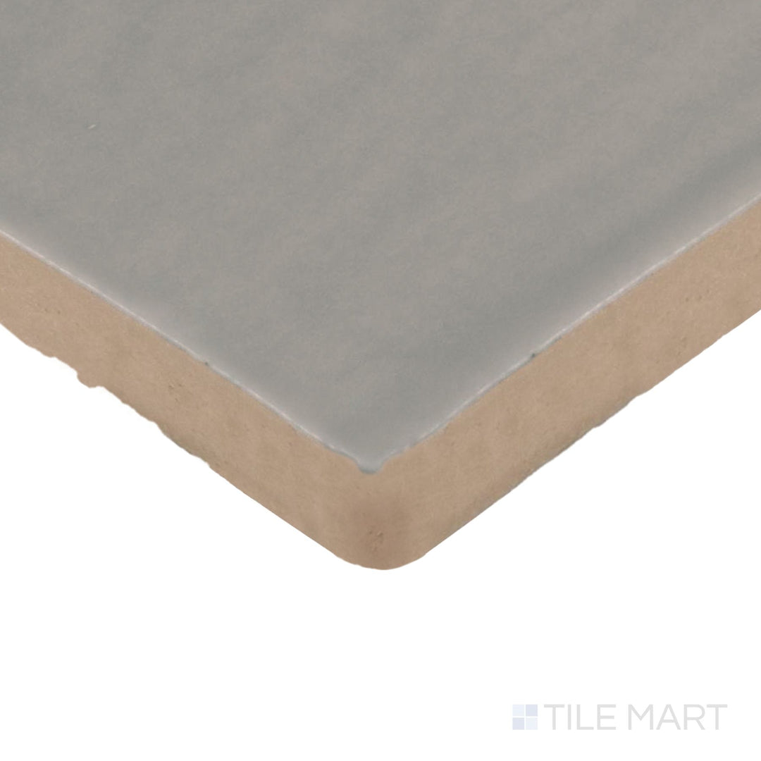 Angled close-up of Farrier Dartmoor Grey 2.5X15 Satin Glazed Ceramic Tile, showcasing its cool grey hues with a sleek satin glaze.