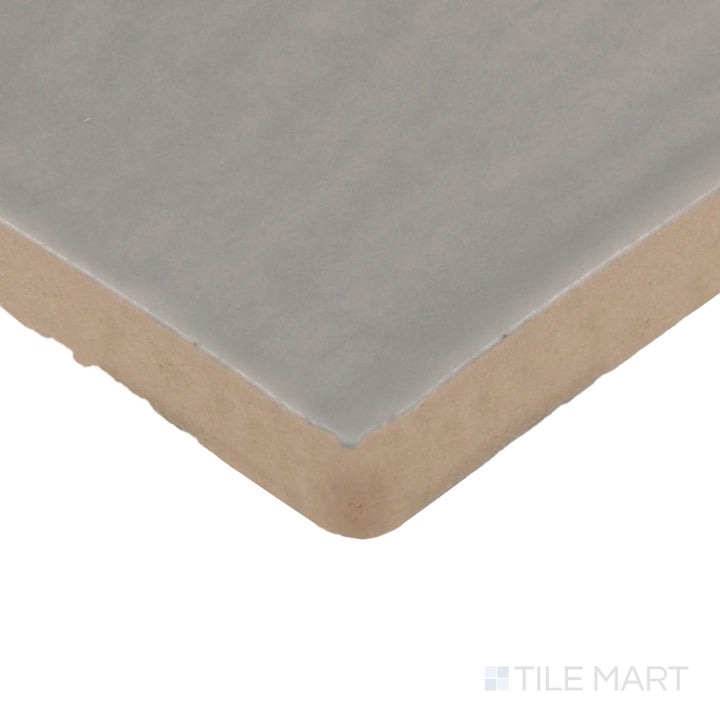 Angled close-up of Farrier Dartmoor Grey 2.5X15 Satin Glazed Ceramic Tile, showcasing its cool grey hues with a sleek satin glaze.