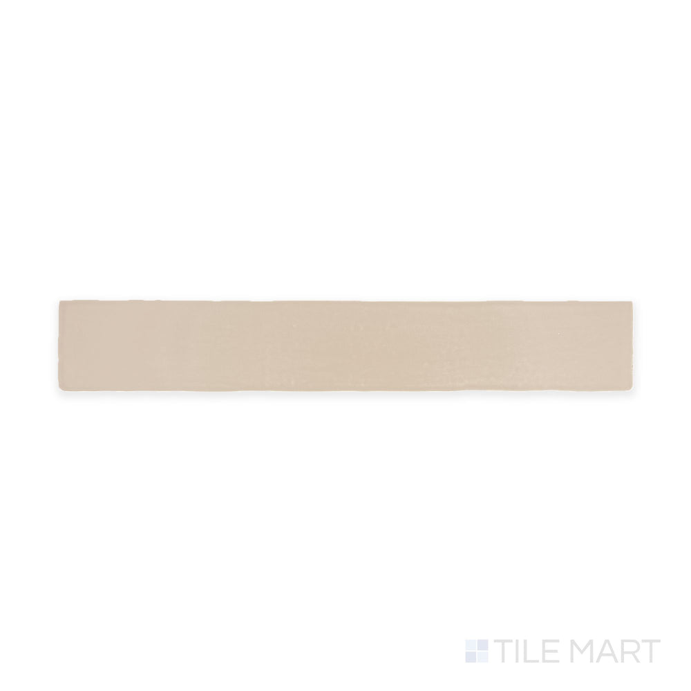 A top-down view of the Farrier Palomino 2.5x15 satin glazed ceramic tile highlights a warm, golden-beige hue with a smooth satin finish, ideal for creating inviting and elegant interiors.