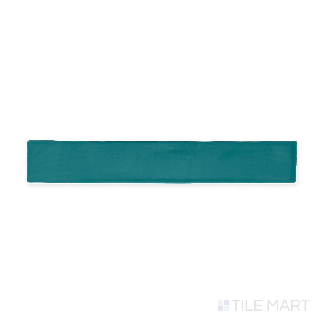 Captured from above, the Farrier Blue Roan 2.5x15 satin glazed ceramic tile presents a cool-toned gray-blue shade with a soft satin glaze, perfect for modern and coastal-inspired designs.