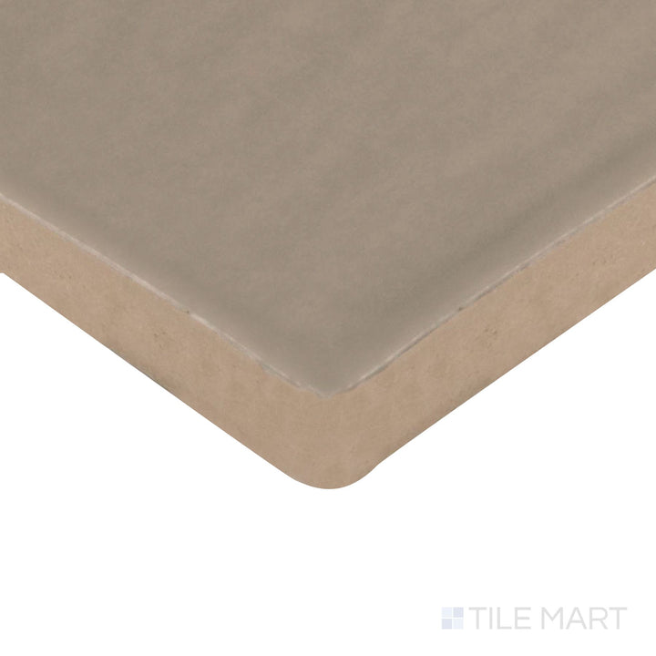 Corner angle of Farrier Grullo 2.5X15 Satin Glazed Ceramic Tile, emphasizing its earthy taupe tones with a smooth, satin surface.