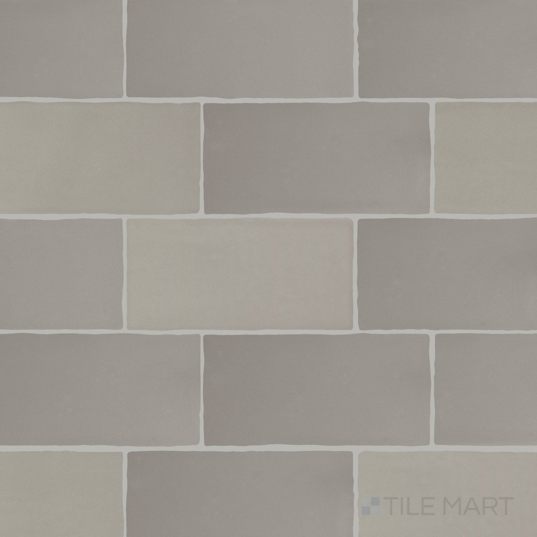 A detailed top-down view of Farrier Dartmoor Grey 2.5x5 satin glazed ceramic tiles, showcasing their cool grey hue and sleek satin coating.
