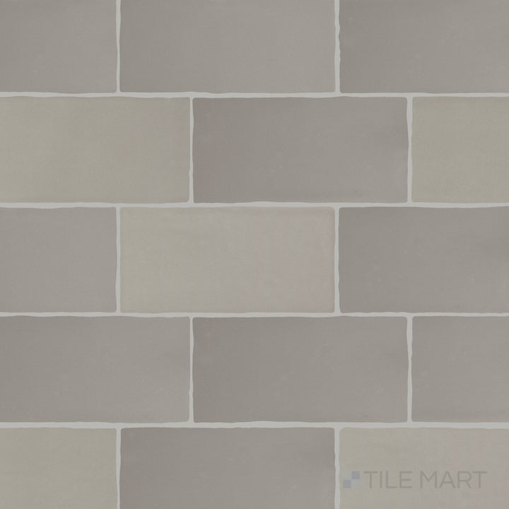 A detailed top-down view of Farrier Dartmoor Grey 2.5x5 satin glazed ceramic tiles, showcasing their cool grey hue and sleek satin coating.