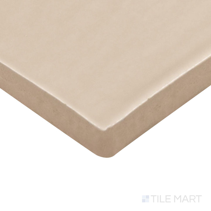 Angled view of Farrier Palomino 2.5X5 Satin Glazed Ceramic Tile, highlighting its warm golden-beige hues with a sleek satin finish.