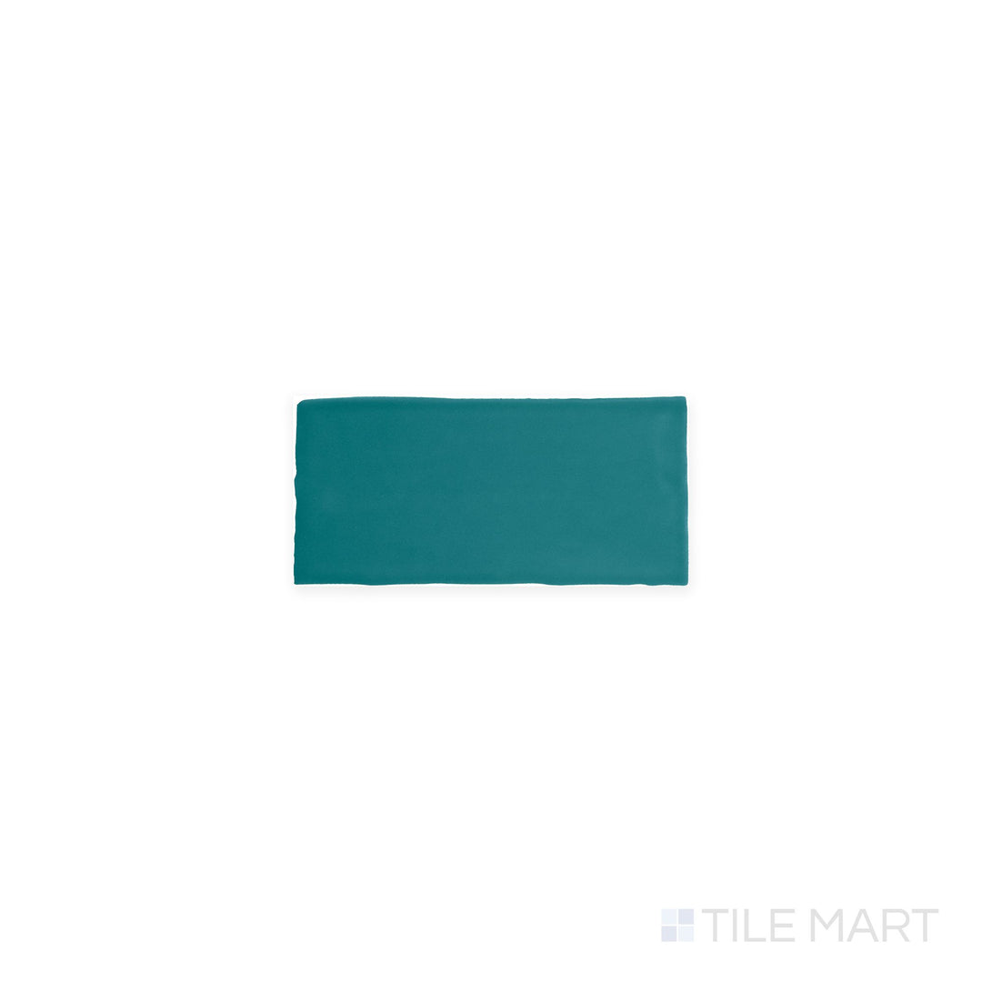 A top-down shot of Farrier Blue Roan 2.5x5 satin glazed ceramic tiles, highlighting their deep blue color and soft glaze.