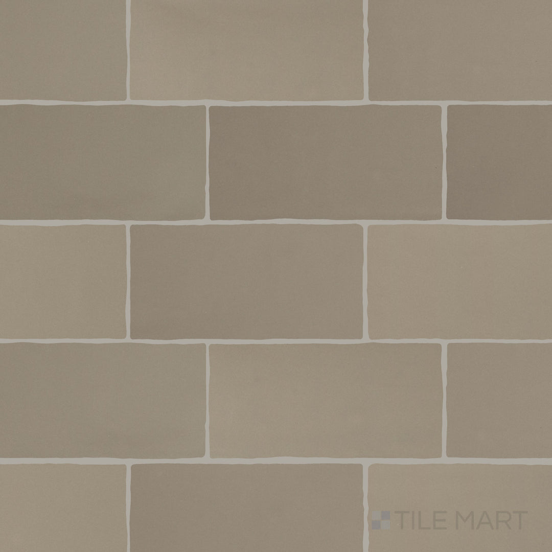 An overview of Farrier Grullo 2.5x5 satin glazed ceramic tiles, capturing their neutral hue and understated satin texture.