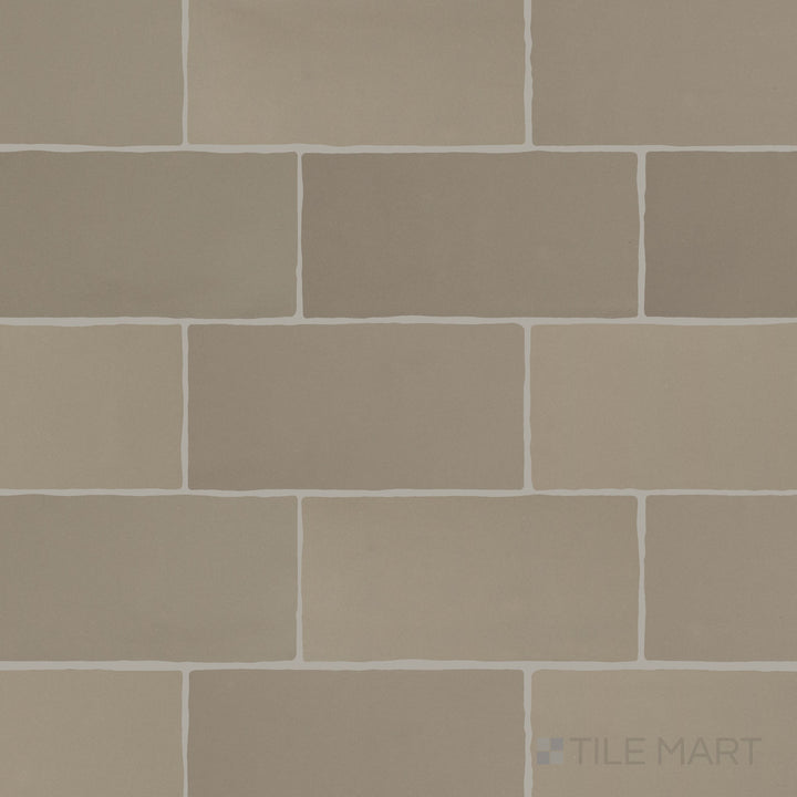 An overview of Farrier Grullo 2.5x5 satin glazed ceramic tiles, capturing their neutral hue and understated satin texture.