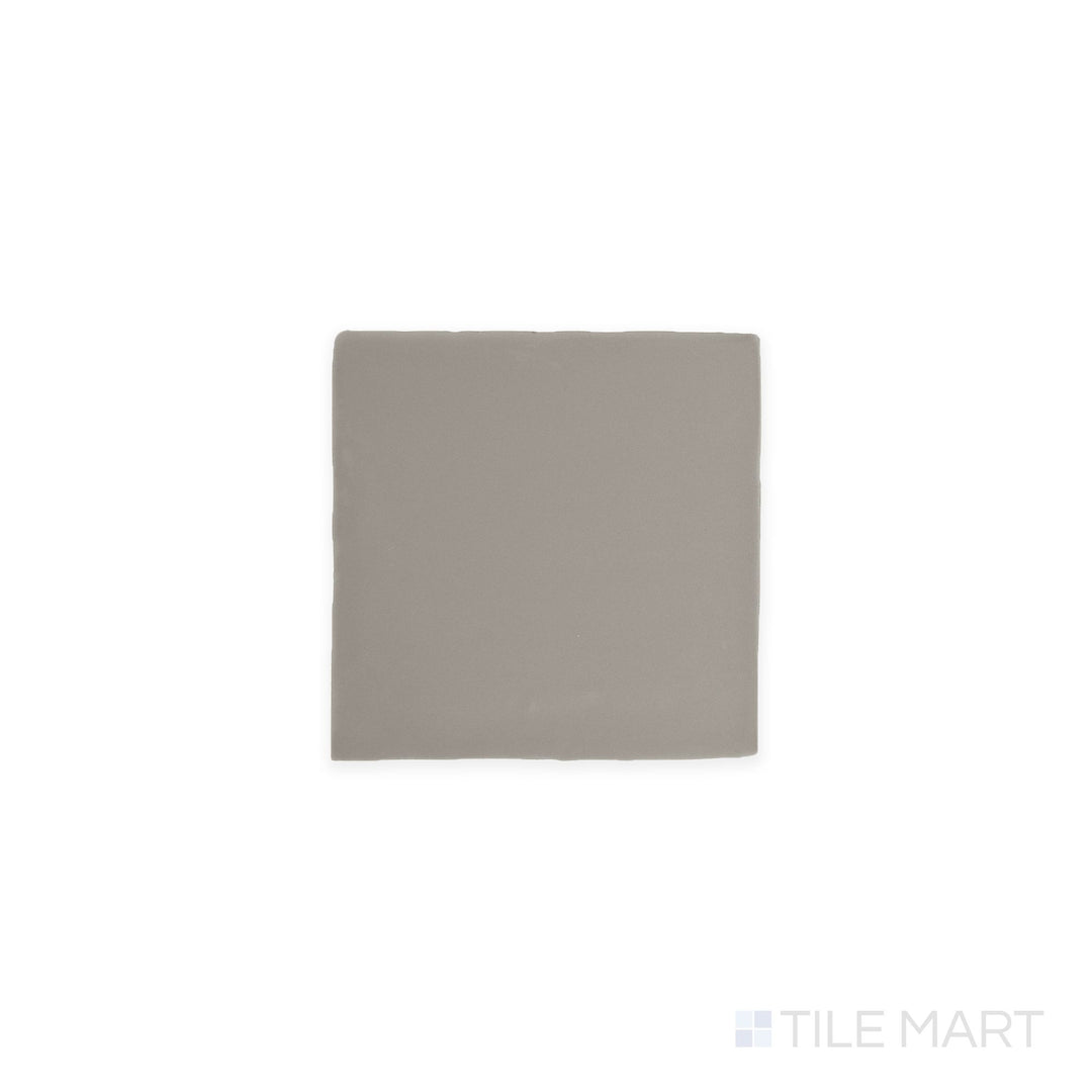 Angled shot of Farrier Dartmoor Grey 5x5 satin glazed ceramic tile, featuring a deep gray tone, a sleek satin finish, and a modern square shape.  