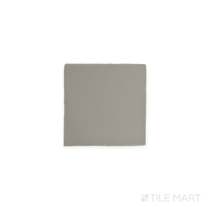 Angled shot of Farrier Dartmoor Grey 5x5 satin glazed ceramic tile, featuring a deep gray tone, a sleek satin finish, and a modern square shape.  