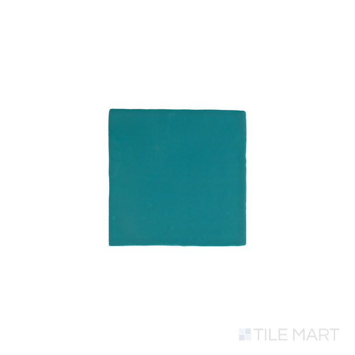Slanted perspective of Farrier Blue Roan 5x5 satin glazed ceramic tile, emphasizing its muted blue-gray hues, smooth satin surface, and contemporary square layout.  