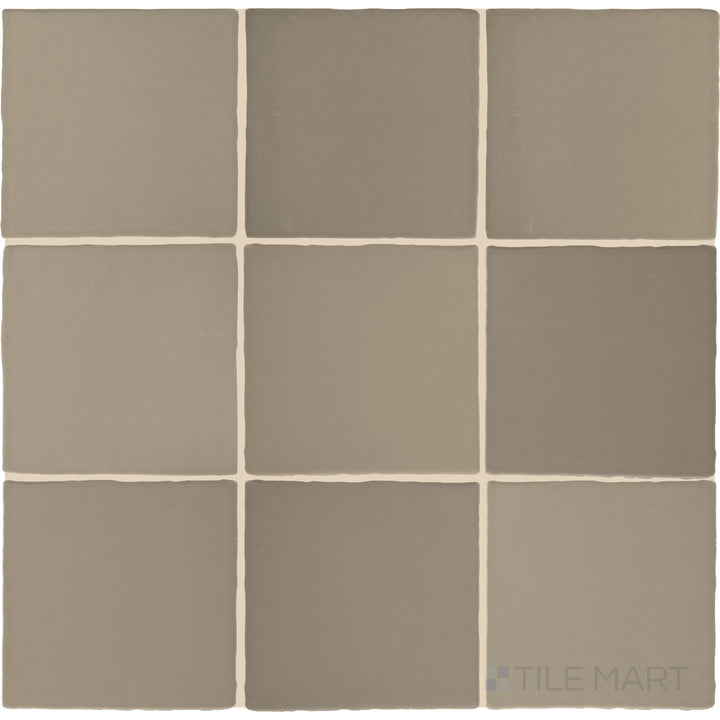 Captured from above, the Farrier Grullo 5x5 satin glazed ceramic tile showcases its earthy taupe-gray hue with a satin finish, delivering a balanced and versatile look for various applications.