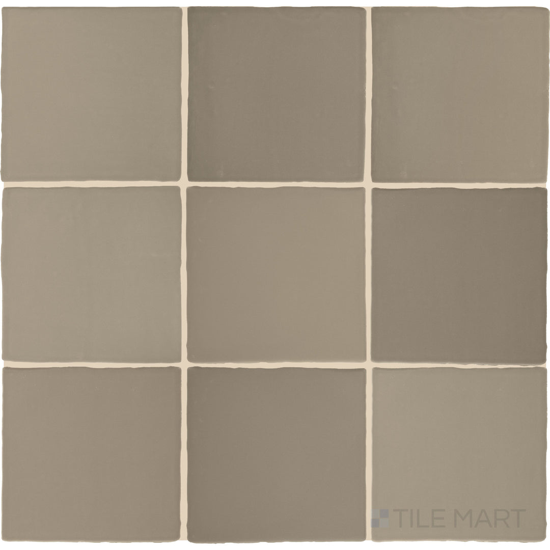 Captured from above, the Farrier Grullo 5x5 satin glazed ceramic tile showcases its earthy taupe-gray hue with a satin finish, delivering a balanced and versatile look for various applications.