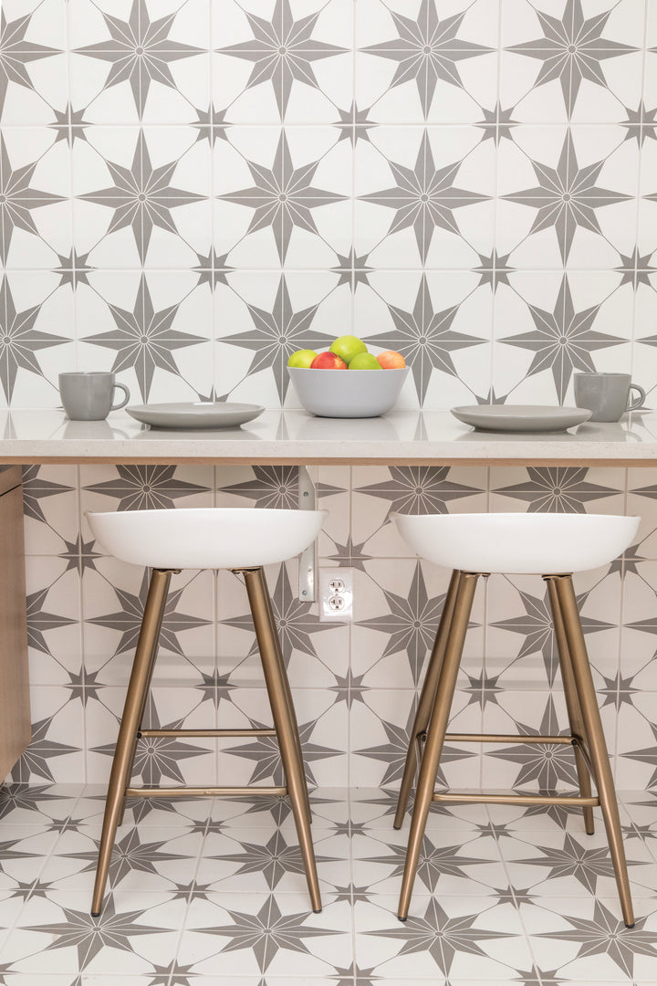 Set against a modern backdrop, the Memoir Jewel Grey 12x12 matte glazed ceramic tile brings out intricate detailing and a muted grey palette with a refined matte surface.