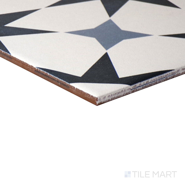 Angled close-up of Memoir Cosmo Blue 12X12 Matte Glazed Ceramic Tile, showcasing its deep blue tones with a muted, matte surface.