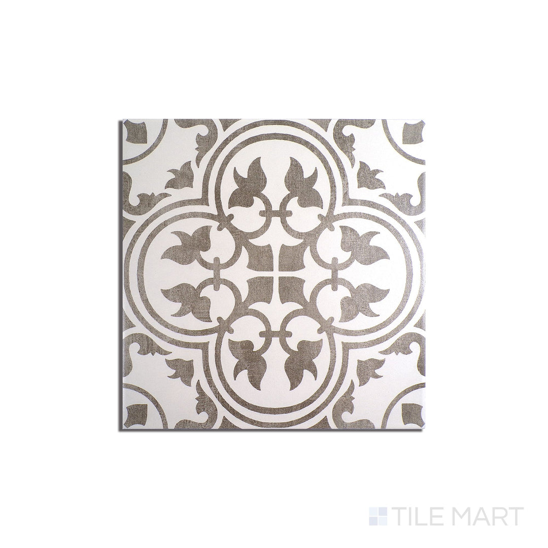 Angled shot of Memoir Petal Grey 12x12 matte glazed ceramic tile, featuring a subtle gray color, delicate matte finish, and an elegant square layout.  