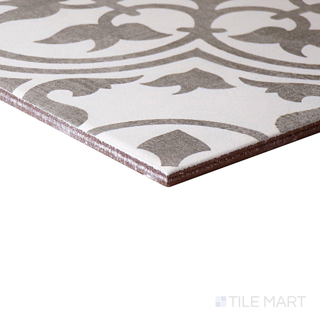 Corner-focused shot of Memoir Petal Grey 12X12 Matte Glazed Ceramic Tile, highlighting its delicate grey shade with a soft, matte floral-inspired texture.