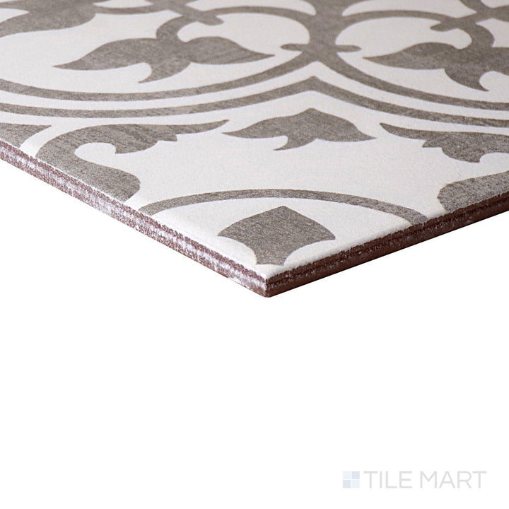 Corner-focused shot of Memoir Petal Grey 12X12 Matte Glazed Ceramic Tile, highlighting its delicate grey shade with a soft, matte floral-inspired texture.