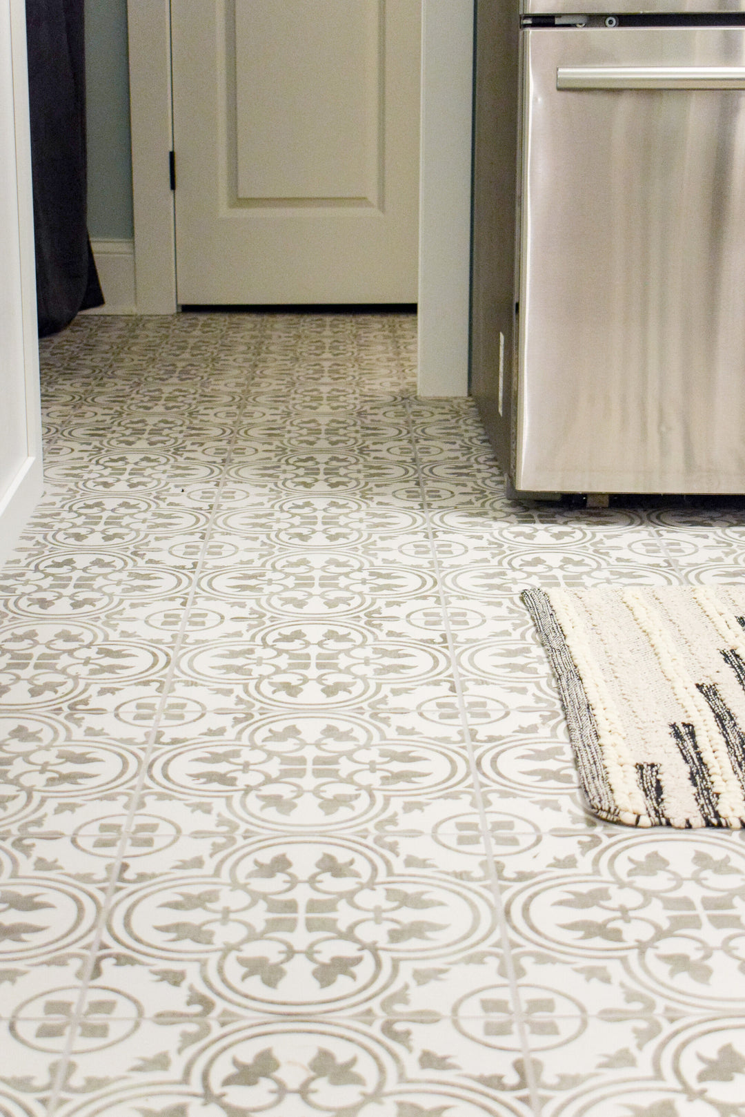 Memoir Petal Grey 12x12 matte glazed ceramic tile featured in a designer scene, bringing out its delicate floral-inspired design and neutral grey palette.