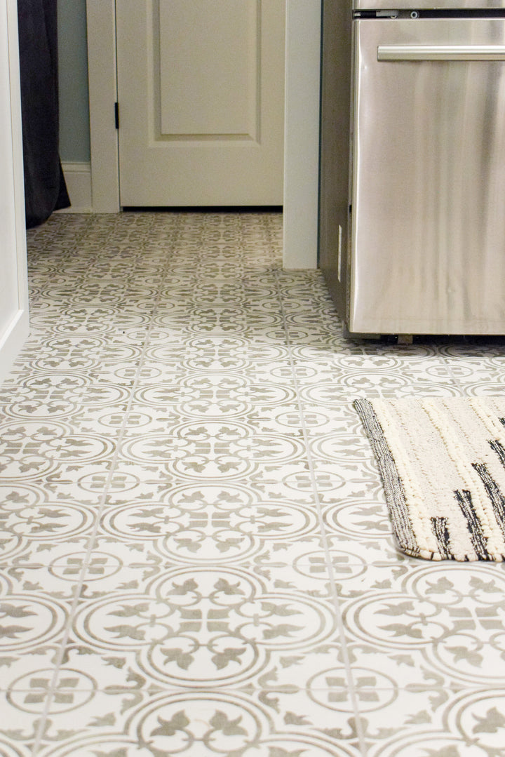 Memoir Petal Grey 12x12 matte glazed ceramic tile featured in a designer scene, bringing out its delicate floral-inspired design and neutral grey palette.