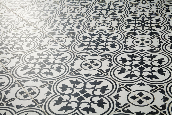 Memoir Petal Black 12x12 matte glazed ceramic tile displayed in a bold interior look, enhancing the space with dramatic tones and subtle matte detailing.