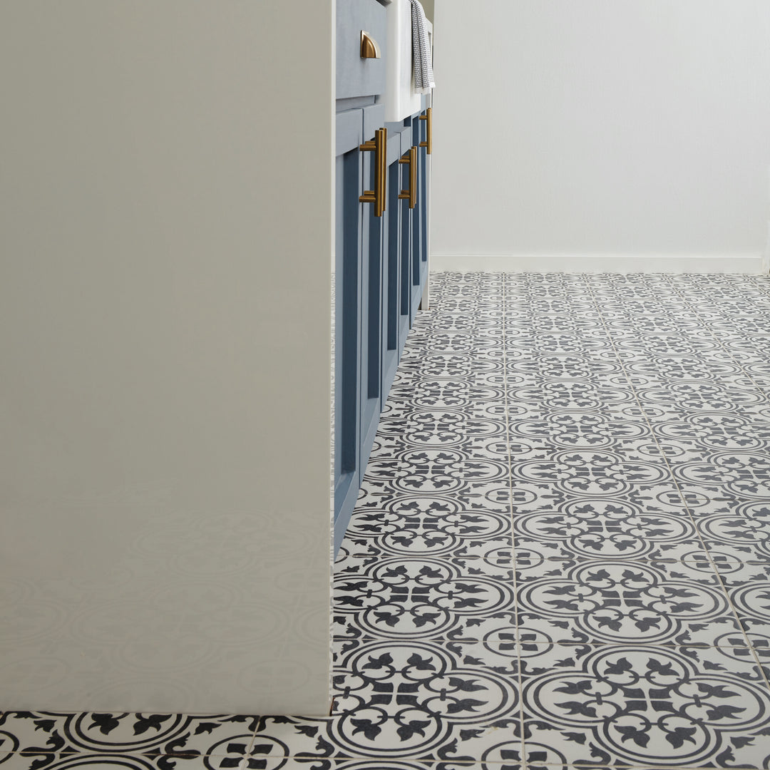 Elevating decorative style, the Memoir Petal Black 12x12 matte glazed ceramic tile contrasts bold black hues with a delicate petal-inspired design.