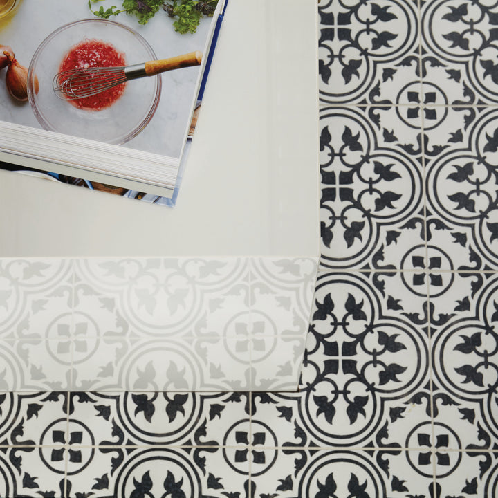 Featuring bold contrast and matte refinement, the Memoir Petal Black 12x12 ceramic tile delivers artistic texture with a dramatic monochrome palette.