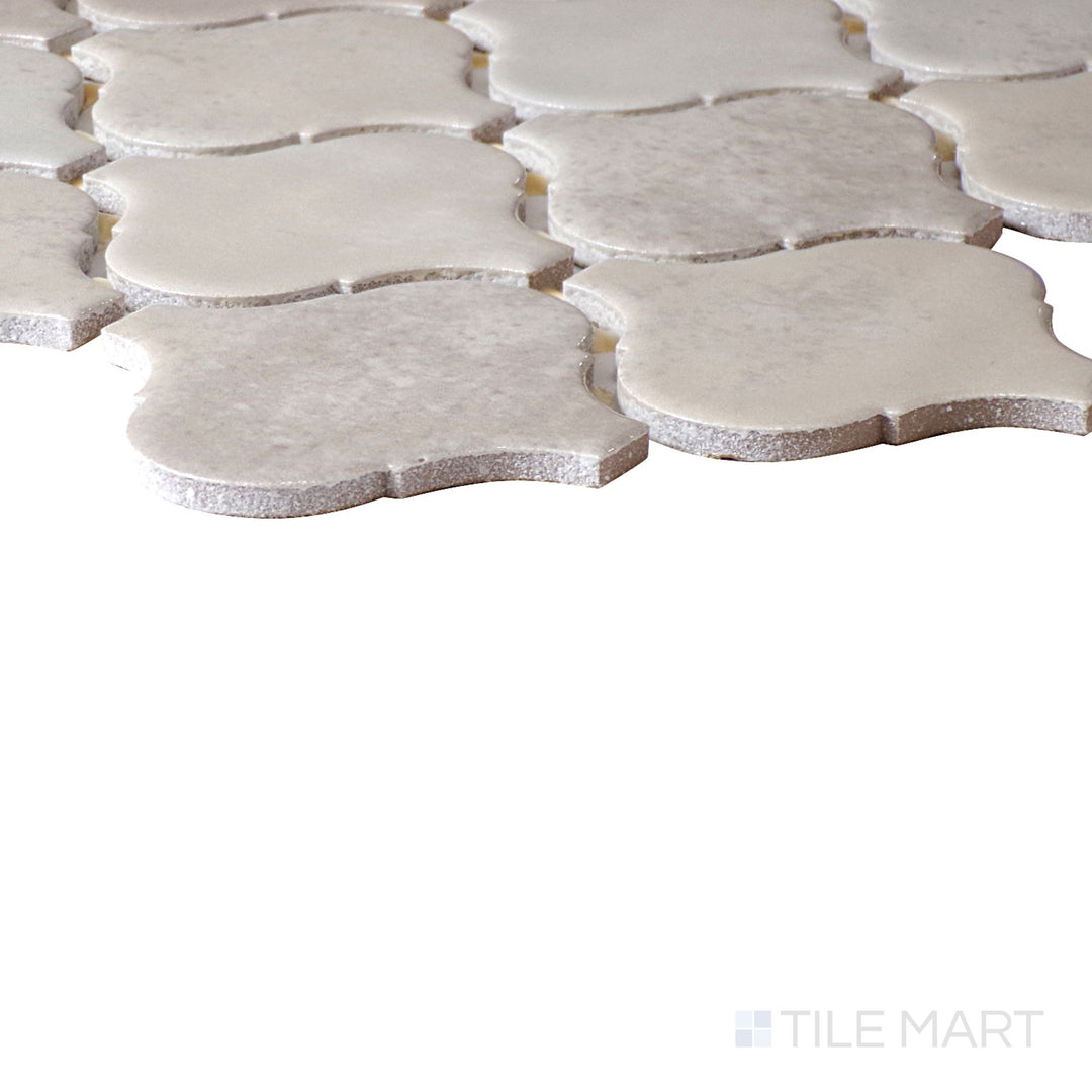 Side perspective of Mesmerist Trance Arabesque Glossy Glazed Ceramic Mosaic, capturing its bold color and elegant arabesque shape with a high-shine surface.