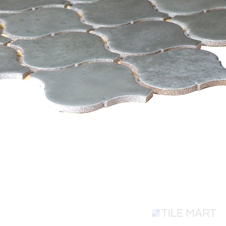 Angled close-up of Mesmerist Charm Arabesque Glossy Glazed Ceramic Mosaic, showcasing its timeless arabesque design with a refined glossy finish.