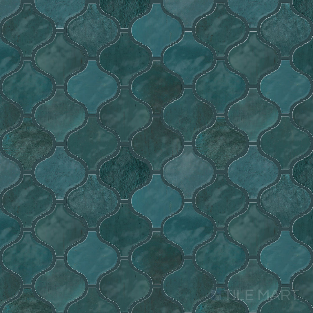 Flat-lay image of the Mesmerist Mystique Arabesque glossy glazed ceramic mosaic, emphasizing its flowing arabesque details and reflective glaze.