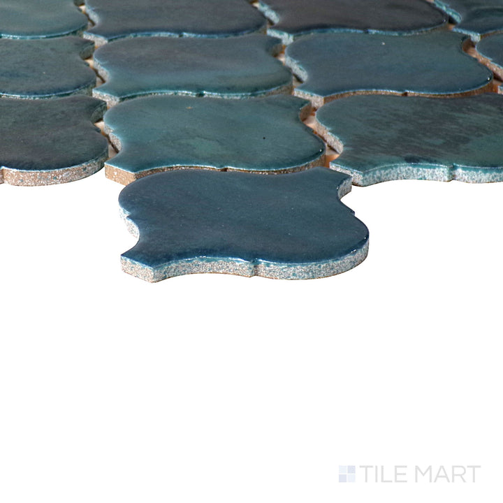 Corner-focused shot of Mesmerist Mystique Arabesque Glossy Glazed Ceramic Mosaic, highlighting its luxurious color and polished arabesque pattern.